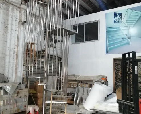Factory trial assembly for 304 stainless steel spiral brushed titanium birdcage stairs case study image