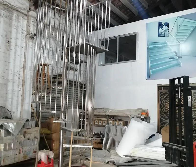 Factory trial assembly for 304 stainless steel spiral brushed titanium birdcage stairs case study image