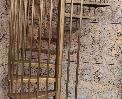 assembly for 304 stainless steel spiral brushed titanium birdcage staircases case study image-stainless steel titanium gold staircase