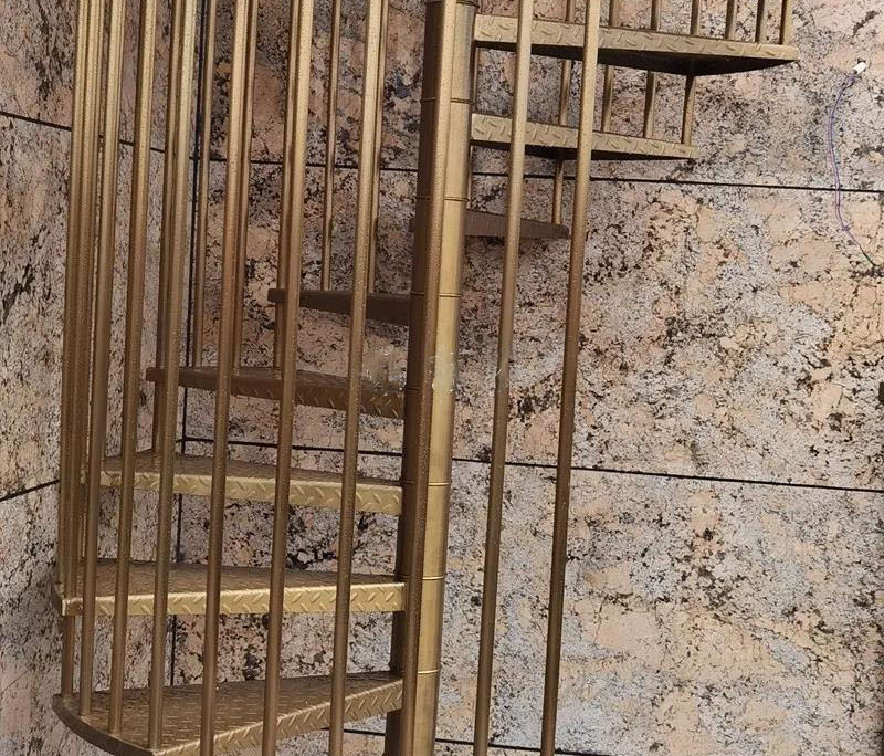 assembly for 304 stainless steel spiral brushed titanium birdcage staircases case study image-stainless steel titanium gold staircase