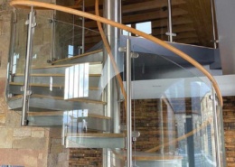 spiral staircase with glass railing