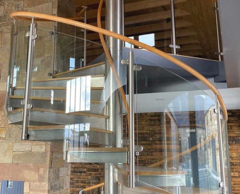 spiral staircase with glass railing