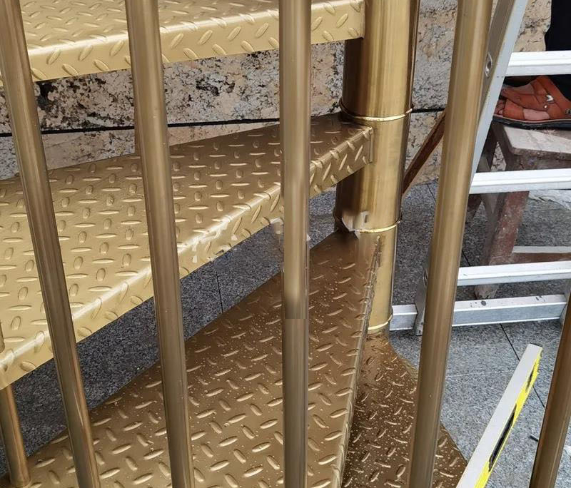 stainless steel spiral brushed titanium birdcage staircases0 case study image-stainless steel titanium gold staircase