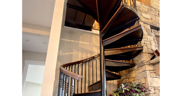 Outdoor metal spiral staircase with iron railing wooden treads